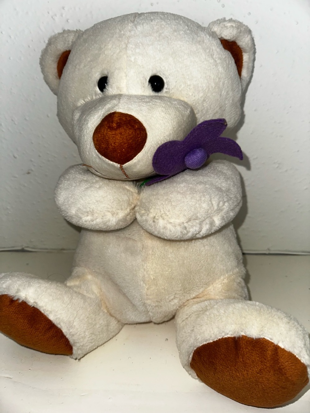 Cream Plush Teddy Bear with Purple Flower